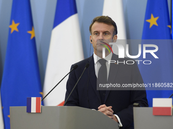 French President Emmanuel Macron looks on during a press conference with Polish Prime Minister Donald Tusk after talks in Warsaw, Poland, on...