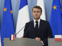 French President Emmanuel Macron looks on during a press conference with Polish Prime Minister Donald Tusk after talks in Warsaw, Poland, on...