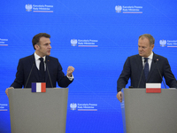 French President Emmanuel Macron gestures as he speaks during a press conference with Polish Prime Minister Donald Tusk after talks in Warsa...