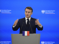 French President Emmanuel Macron gestures as he speaks during a press conference with Polish Prime Minister Donald Tusk after talks in Warsa...