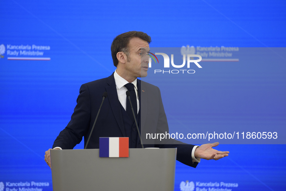 French President Emmanuel Macron gestures as he speaks during a press conference with Polish Prime Minister Donald Tusk after talks in Warsa...