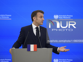 French President Emmanuel Macron gestures as he speaks during a press conference with Polish Prime Minister Donald Tusk after talks in Warsa...