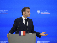 French President Emmanuel Macron gestures as he speaks during a press conference with Polish Prime Minister Donald Tusk after talks in Warsa...