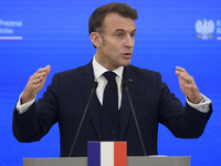 French President Emmanuel Macron gestures as he speaks during a press conference with Polish Prime Minister Donald Tusk after talks in Warsa...