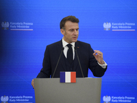 French President Emmanuel Macron gestures as he speaks during a press conference with Polish Prime Minister Donald Tusk after talks in Warsa...