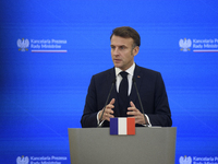 French President Emmanuel Macron gestures as he speaks during a press conference with Polish Prime Minister Donald Tusk after talks in Warsa...