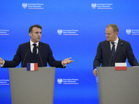 French President Emmanuel Macron and Polish Prime Minister Donald Tusk hold a press conference after talks in Warsaw, Poland, on December 12...