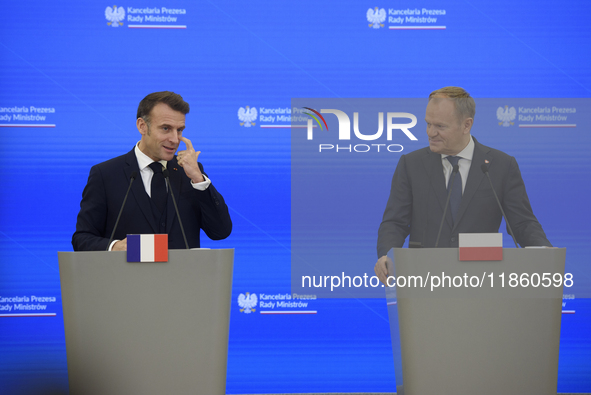 French President Emmanuel Macron and Polish Prime Minister Donald Tusk hold a press conference after talks in Warsaw, Poland, on December 12...