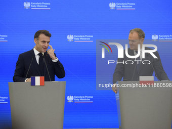 French President Emmanuel Macron and Polish Prime Minister Donald Tusk hold a press conference after talks in Warsaw, Poland, on December 12...