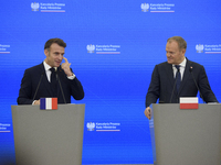 French President Emmanuel Macron and Polish Prime Minister Donald Tusk hold a press conference after talks in Warsaw, Poland, on December 12...