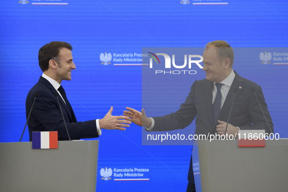 French President Emmanuel Macron and Polish Prime Minister Donald Tusk hold a press conference after talks in Warsaw, Poland, on December 12...