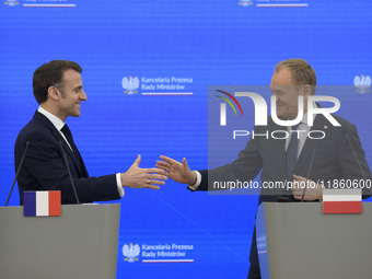 French President Emmanuel Macron and Polish Prime Minister Donald Tusk hold a press conference after talks in Warsaw, Poland, on December 12...