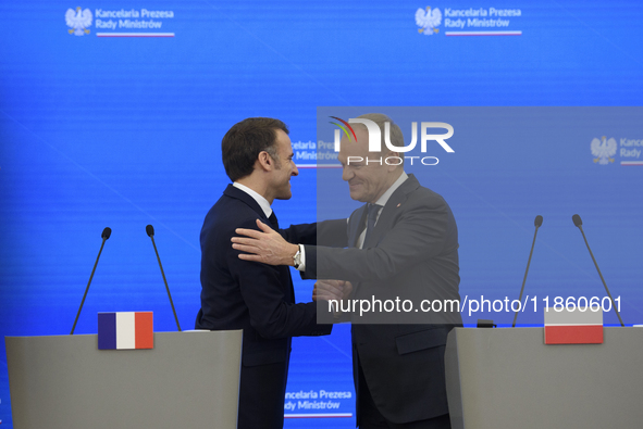 French President Emmanuel Macron and Polish Prime Minister Donald Tusk hold a press conference after talks in Warsaw, Poland, on December 12...