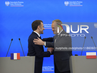 French President Emmanuel Macron and Polish Prime Minister Donald Tusk hold a press conference after talks in Warsaw, Poland, on December 12...