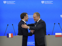 French President Emmanuel Macron and Polish Prime Minister Donald Tusk hold a press conference after talks in Warsaw, Poland, on December 12...