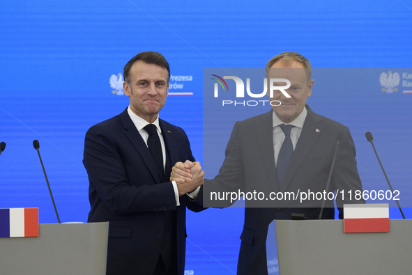 French President Emmanuel Macron and Polish Prime Minister Donald Tusk hold a press conference after talks in Warsaw, Poland, on December 12...