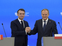 French President Emmanuel Macron and Polish Prime Minister Donald Tusk hold a press conference after talks in Warsaw, Poland, on December 12...