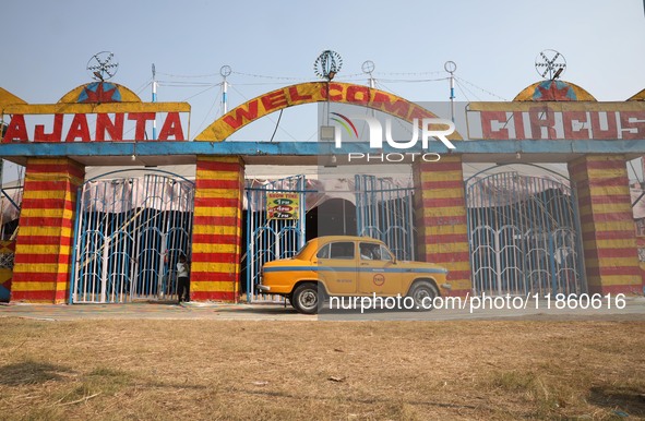 A yellow ambassador taxi parks in front of the Ajanta Circus entry gate in Kolkata, India, on December 12, 2024. There are currently fewer t...