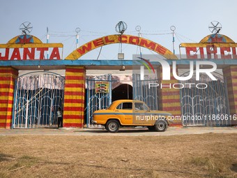 A yellow ambassador taxi parks in front of the Ajanta Circus entry gate in Kolkata, India, on December 12, 2024. There are currently fewer t...