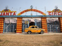 A yellow ambassador taxi parks in front of the Ajanta Circus entry gate in Kolkata, India, on December 12, 2024. There are currently fewer t...