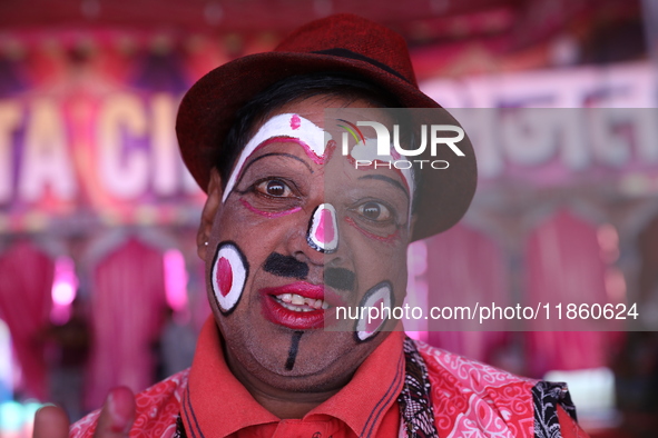 A clown poses for a picture before his performance during a show of the Ajanta Circus in Kolkata, India, on December 12, 2024. There are cur...