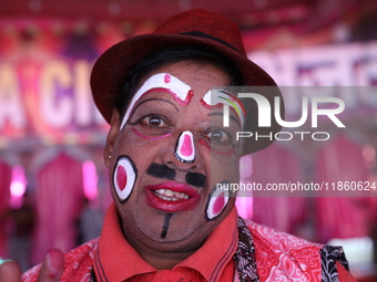 A clown poses for a picture before his performance during a show of the Ajanta Circus in Kolkata, India, on December 12, 2024. There are cur...