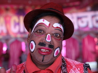 A clown poses for a picture before his performance during a show of the Ajanta Circus in Kolkata, India, on December 12, 2024. There are cur...