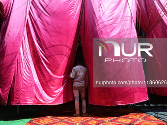 A circus artiste waits before a show of the Ajanta Circus in Kolkata, India, on December 12, 2024. There are currently fewer than 30 circuse...