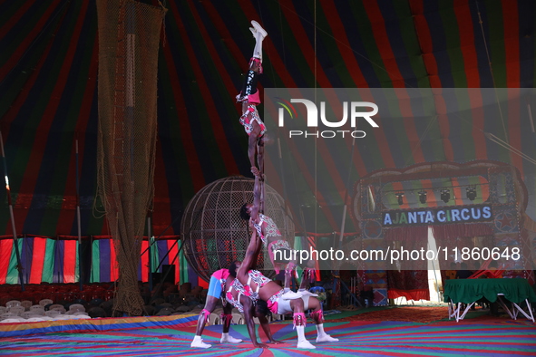 Circus artists perform during a show of the Ajanta Circus in Kolkata, India, on December 12, 2024. There are currently fewer than 30 circuse...