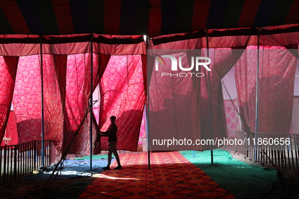 A circus artiste waits before a show of the Ajanta Circus in Kolkata, India, on December 12, 2024. There are currently fewer than 30 circuse...