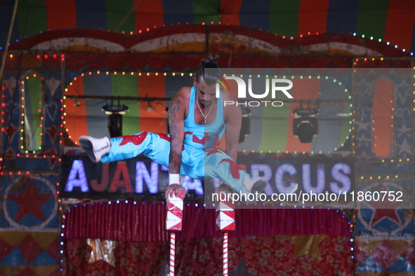 A circus artiste performs during a show of the Ajanta Circus in Kolkata, India, on December 12, 2024. There are currently fewer than 30 circ...