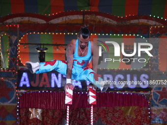 A circus artiste performs during a show of the Ajanta Circus in Kolkata, India, on December 12, 2024. There are currently fewer than 30 circ...