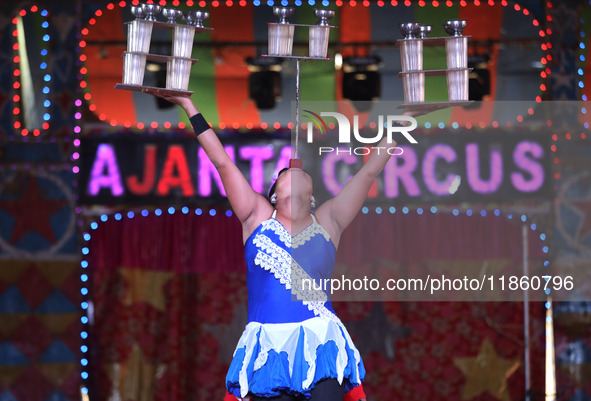 A circus artiste performs during a show of the Ajanta Circus in Kolkata, India, on December 12, 2024. There are currently fewer than 30 circ...