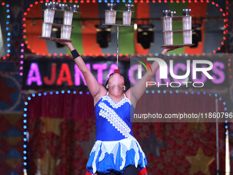 A circus artiste performs during a show of the Ajanta Circus in Kolkata, India, on December 12, 2024. There are currently fewer than 30 circ...