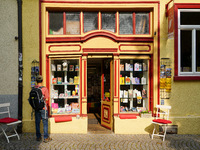 A young man stops to admire the display of books in the windows of Buchladen Die Zeitgenossen in Esslingen, Germany, on June 30, 2023. The b...