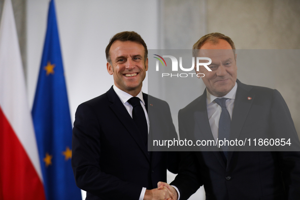 In Warsaw, Poland, on December 12, 2024, President of the French Republic Emmanuel Macron meets with Prime Minister of Poland Donald Tusk at...