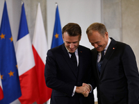 In Warsaw, Poland, on December 12, 2024, President of the French Republic Emmanuel Macron meets with Prime Minister of Poland Donald Tusk at...