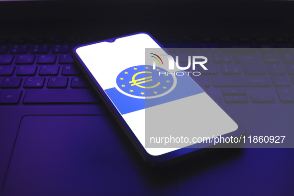 The European Central Bank (ECB) logo appears on the screen of a smartphone in Reno, United States, on December 12, 2024. The central bank is...