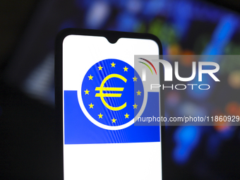 The European Central Bank (ECB) logo appears on the screen of a smartphone in Reno, United States, on December 12, 2024. The central bank is...