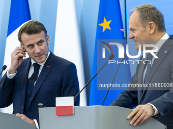 French President Emmanuel Macron (L)  and Prime Minister Donald Tusk make a statement after a meeting at the Prime Minister's Office in Wars...