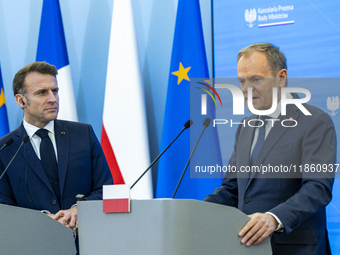 Prime Minister Donald Tusk and French President Emmanuel Macron make a statement after a meeting at the Prime Minister's Office in Warsaw. T...