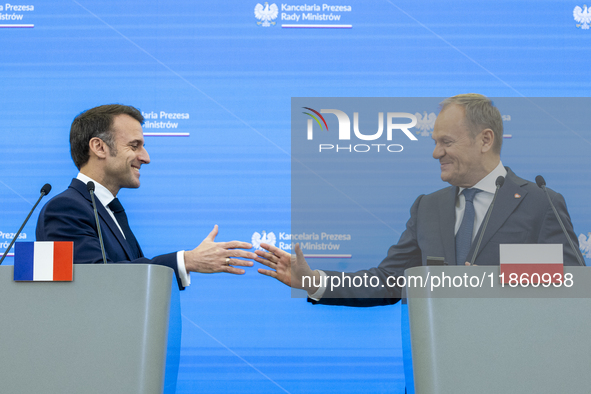 Prime Minister Donald Tusk and French President Emmanuel Macron make a statement after a meeting at the Prime Minister's Office in Warsaw. T...