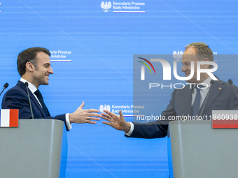 Prime Minister Donald Tusk and French President Emmanuel Macron make a statement after a meeting at the Prime Minister's Office in Warsaw. T...