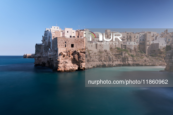 This image captures Lama Monachile, a famous cove in Polignano a Mare, Italy, on October 5, 2020. 