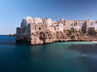 This image captures Lama Monachile, a famous cove in Polignano a Mare, Italy, on October 5, 2020. (