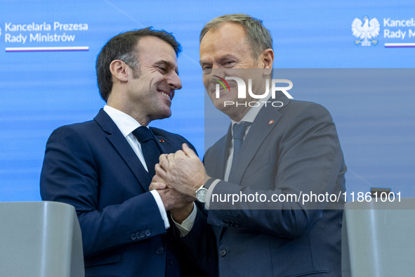 French President Emmanuel Macron (L)  and Prime Minister Donald Tusk after a  press meeting at the Prime Minister's Office in Warsaw. The le...