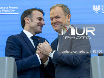 French President Emmanuel Macron (L)  and Prime Minister Donald Tusk after a  press meeting at the Prime Minister's Office in Warsaw. The le...