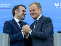 French President Emmanuel Macron (L)  and Prime Minister Donald Tusk after a  press meeting at the Prime Minister's Office in Warsaw. The le...