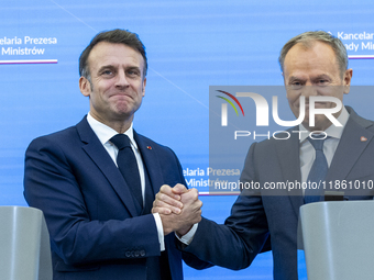 French President Emmanuel Macron (L) and Prime Minister Donald Tusk after a  press meeting at the Prime Minister's Office in Warsaw. The lea...