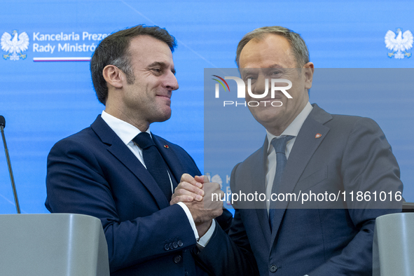 French President Emmanuel Macron (L)  and Prime Minister Donald Tusk after a  press meeting at the Prime Minister's Office in Warsaw. The le...